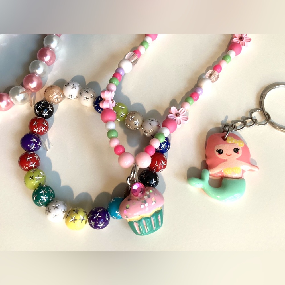Cupcake necklace, 2 bracelets, mermaid key chain and mermaid pendant.